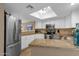 Bright kitchen features stainless steel appliances, granite countertops, and a skylight at 16739 E El Lago Blvd # 103, Fountain Hills, AZ 85268