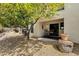 Charming patio with outdoor seating, set in a serene landscape with a mature tree at 16739 E El Lago Blvd # 103, Fountain Hills, AZ 85268