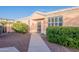 Charming single-story home featuring a well-manicured front yard with mature shrubs and desert landscaping at 17216 E Salida Dr # B, Fountain Hills, AZ 85268
