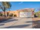 Single-story home with private two-car garage, desert landscaping, and tile roof at 17216 E Salida Dr # B, Fountain Hills, AZ 85268