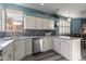 Bright kitchen with stainless steel appliances, white cabinets, stylish backsplash, and natural light from the window at 17216 E Salida Dr # B, Fountain Hills, AZ 85268