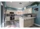 Beautiful kitchen with white cabinets, stainless steel appliances, stylish backsplash, and a breakfast bar at 17216 E Salida Dr # B, Fountain Hills, AZ 85268