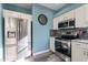Well-equipped kitchen with stainless steel appliances, gray backsplash, ample storage, and stylish gray flooring at 17216 E Salida Dr # B, Fountain Hills, AZ 85268