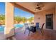 Relaxing patio with a fire pit and a view of the pool at 17216 E Salida Dr # B, Fountain Hills, AZ 85268