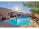 Backyard with a sparkling pool, hot tub, covered patio, and drought resistant desert landscaping at 17216 E Salida Dr # B, Fountain Hills, AZ 85268