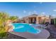 Backyard oasis with a sparkling pool, hot tub, lounge chairs, and a covered patio for outdoor entertaining at 17216 E Salida Dr # B, Fountain Hills, AZ 85268
