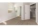 Bedroom featuring mirrored closet doors and neutral carpeting at 17507 N Costa Brava Ave, Maricopa, AZ 85139