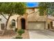 Charming two-story home with arched entry, desert landscaping, and two-car garage at 17507 N Costa Brava Ave, Maricopa, AZ 85139