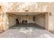 Spacious two-car garage, showcasing ample storage, lighting, and a clean concrete floor at 17507 N Costa Brava Ave, Maricopa, AZ 85139