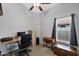 Efficient home office with desk, office chair, filing cabinet, and natural light from a window at 1770 W Derringer Way, Chandler, AZ 85286