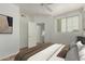 Bright bedroom features ceiling fan, modern decor, and access to closet space at 18250 N Cave Creek Rd # 147, Phoenix, AZ 85032