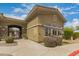 The community clubhouse is surrounded by fresh landscaping at 18250 N Cave Creek Rd # 147, Phoenix, AZ 85032