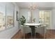 Dining area with neutral colors, pendant lighting, and views to the exterior at 18250 N Cave Creek Rd # 147, Phoenix, AZ 85032