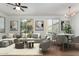 Bright living room with a ceiling fan, natural light and modern furniture at 18250 N Cave Creek Rd # 147, Phoenix, AZ 85032