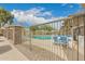 Community pool enclosed by a fence with lots of lounge seating at 18250 N Cave Creek Rd # 147, Phoenix, AZ 85032