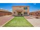 Large backyard with synthetic grass, a BBQ, sport court and block wall at 18318 W Pueblo Ave, Goodyear, AZ 85338