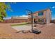 Spacious backyard features a basketball hoop, volleyball net and plenty of space to run and play at 18318 W Pueblo Ave, Goodyear, AZ 85338
