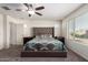 Serene bedroom with neutral tones, a cozy bed, and an abundance of natural light at 18318 W Pueblo Ave, Goodyear, AZ 85338