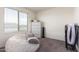 Well-lit bedroom featuring a large window, white dresser, and plenty of space at 18318 W Pueblo Ave, Goodyear, AZ 85338