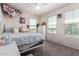 Bright bedroom with large windows, plush carpeting, and ample natural light at 18318 W Pueblo Ave, Goodyear, AZ 85338