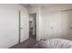 Neutral colored bedroom with neutral decor and easy access to the laundry room at 18318 W Pueblo Ave, Goodyear, AZ 85338