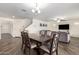 Open concept dining room featuring stylish wood table and seating for six at 18318 W Pueblo Ave, Goodyear, AZ 85338