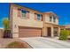 Charming two-story home with a desert landscaped front yard, a concrete driveway, and inviting curb appeal at 18318 W Pueblo Ave, Goodyear, AZ 85338
