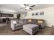 Inviting living room features a plush sectional sofa and neutral color palette at 18318 W Pueblo Ave, Goodyear, AZ 85338