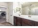 Bathroom features double sinks, large mirror, and a separate walk-in shower and closet at 18318 W Pueblo Ave, Goodyear, AZ 85338