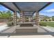 Outdoor BBQ area with built-in grills and seating, ideal for hosting community events and cookouts at 1900 N 140Th Dr, Goodyear, AZ 85395