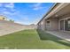 Spacious backyard features artificial turf, providing a clean and comfortable space for outdoor activities at 1900 N 140Th Dr, Goodyear, AZ 85395