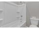 Clean white bathroom has a shower/tub combo and a toilet with matching white features at 1900 N 140Th Dr, Goodyear, AZ 85395