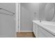 Bright bathroom features a double sink vanity, grey walls, tile floors, and modern fixtures at 1900 N 140Th Dr, Goodyear, AZ 85395