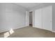Neutral bedroom features a closet with sliding doors and a carpeted floor at 1900 N 140Th Dr, Goodyear, AZ 85395