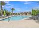 Inviting community pool with poolside seating and shade for relaxing and enjoying sunny days at 1900 N 140Th Dr, Goodyear, AZ 85395
