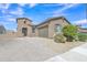 Charming single-story home features desert landscaping, paver driveway, and a two-car garage at 1900 N 140Th Dr, Goodyear, AZ 85395