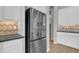 Stainless steel refrigerator complements this kitchen's clean design and modern features at 1900 N 140Th Dr, Goodyear, AZ 85395