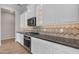 Kitchen featuring modern stainless steel appliances, ample cabinet space, and tiled backsplash at 1900 N 140Th Dr, Goodyear, AZ 85395