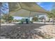 Community playground with various play structures and shade sails, providing a fun and safe environment for  at 1900 N 140Th Dr, Goodyear, AZ 85395