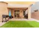Backyard shaded patio with a picnic table and grill, ideal for outdoor gatherings and relaxation at 19043 E Seagull Dr, Queen Creek, AZ 85142