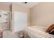 Bedroom featuring neutral walls, plush carpeting, and a comfortable bed under a window with coverings at 19043 E Seagull Dr, Queen Creek, AZ 85142