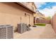 This property's exterior has a covered patio and HVAC unit for the home, with easy access at 19043 E Seagull Dr, Queen Creek, AZ 85142