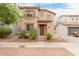 Charming two-story home with a well-manicured front yard at 19043 E Seagull Dr, Queen Creek, AZ 85142