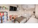 A cozy living space with a comfy sofa, a large TV, and playful décor for a relaxed vibe at 19043 E Seagull Dr, Queen Creek, AZ 85142