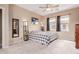 Bright main bedroom with ceiling fan and carpet flooring at 19043 E Seagull Dr, Queen Creek, AZ 85142