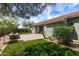Well-manicured backyard featuring artificial turf and desert landscaping at 23063 W Loma Linda Blvd, Buckeye, AZ 85326