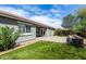 Lush backyard with green grass, brick accents, and landscaping at 23063 W Loma Linda Blvd, Buckeye, AZ 85326