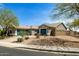 Charming single-story home featuring a three-car garage, desert landscaping, and a neutral color scheme at 23063 W Loma Linda Blvd, Buckeye, AZ 85326