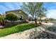 Charming single-story home with a manicured front yard and desert landscaping at 23063 W Loma Linda Blvd, Buckeye, AZ 85326