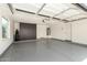 Well-organized garage with storage cabinets and durable epoxy flooring at 23063 W Loma Linda Blvd, Buckeye, AZ 85326